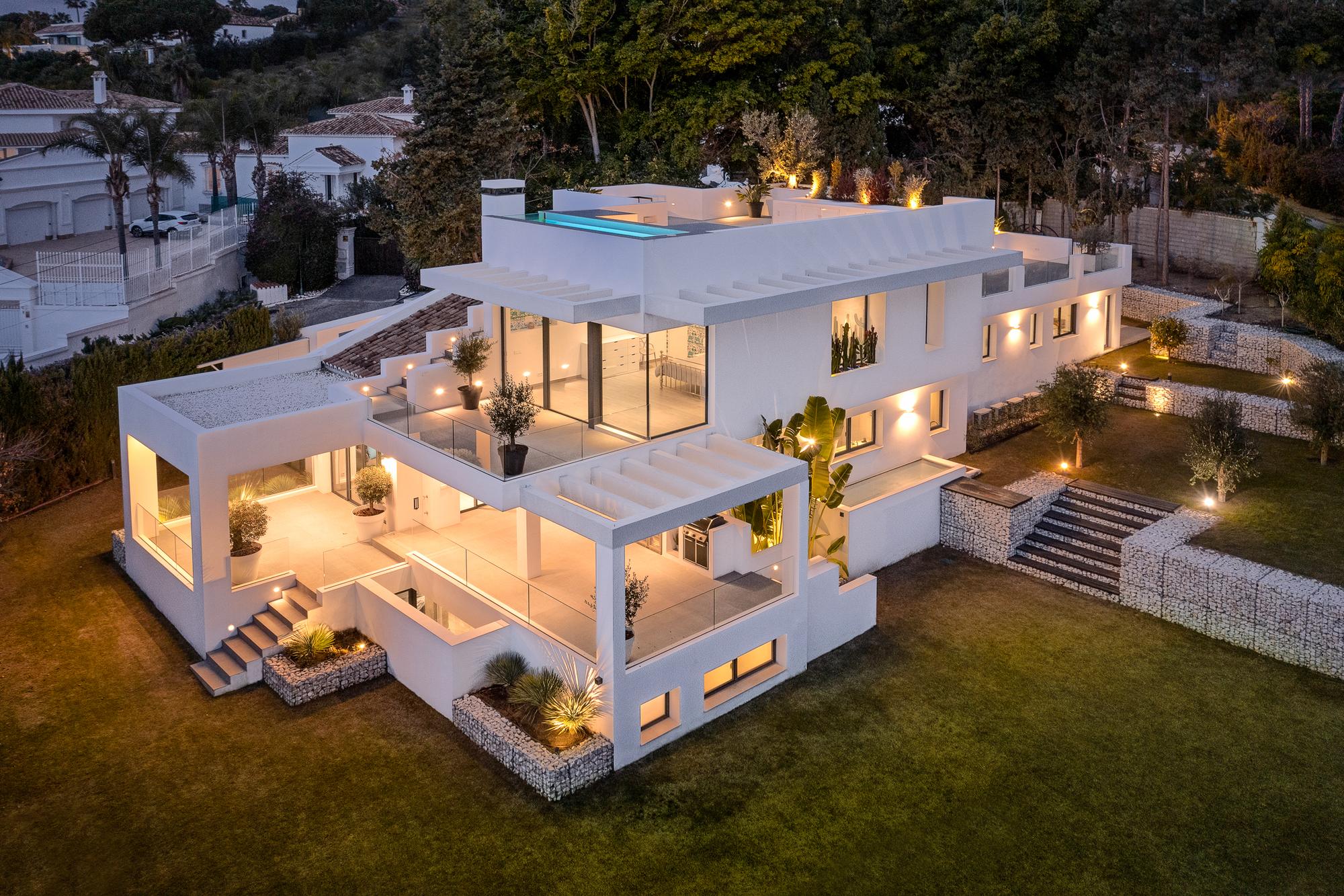 Aerial view of Casa Amigos lit at nightfall