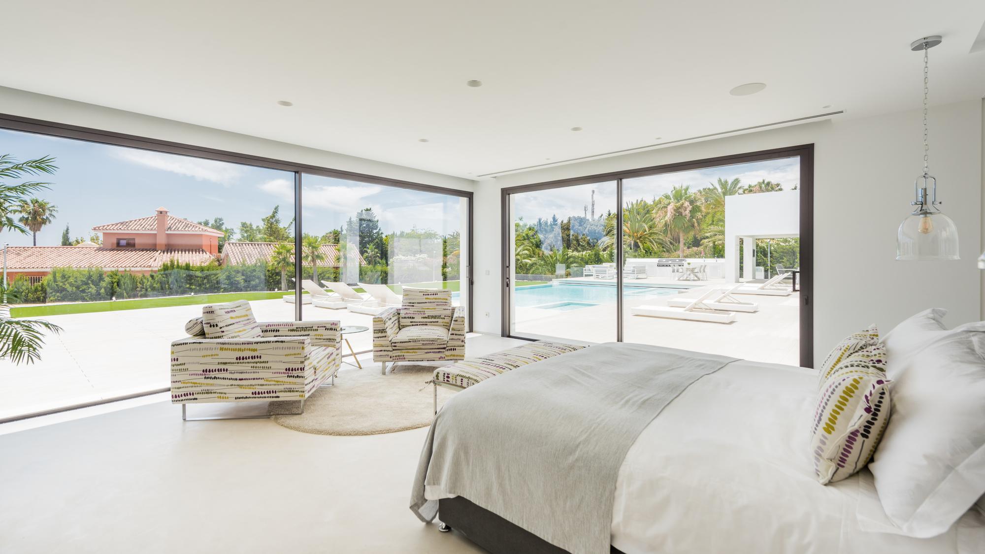 Master bedroom at Villa El Pilar with corner glazing