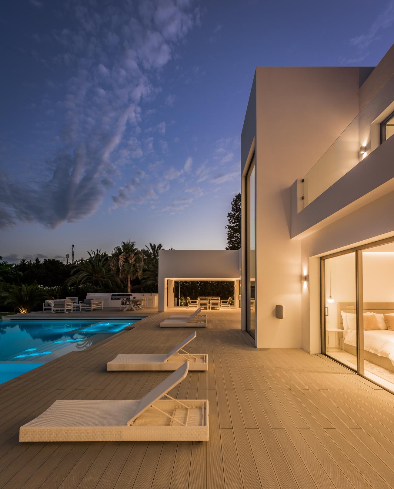 Terrace and porch at Villa El Pilar at nightfall